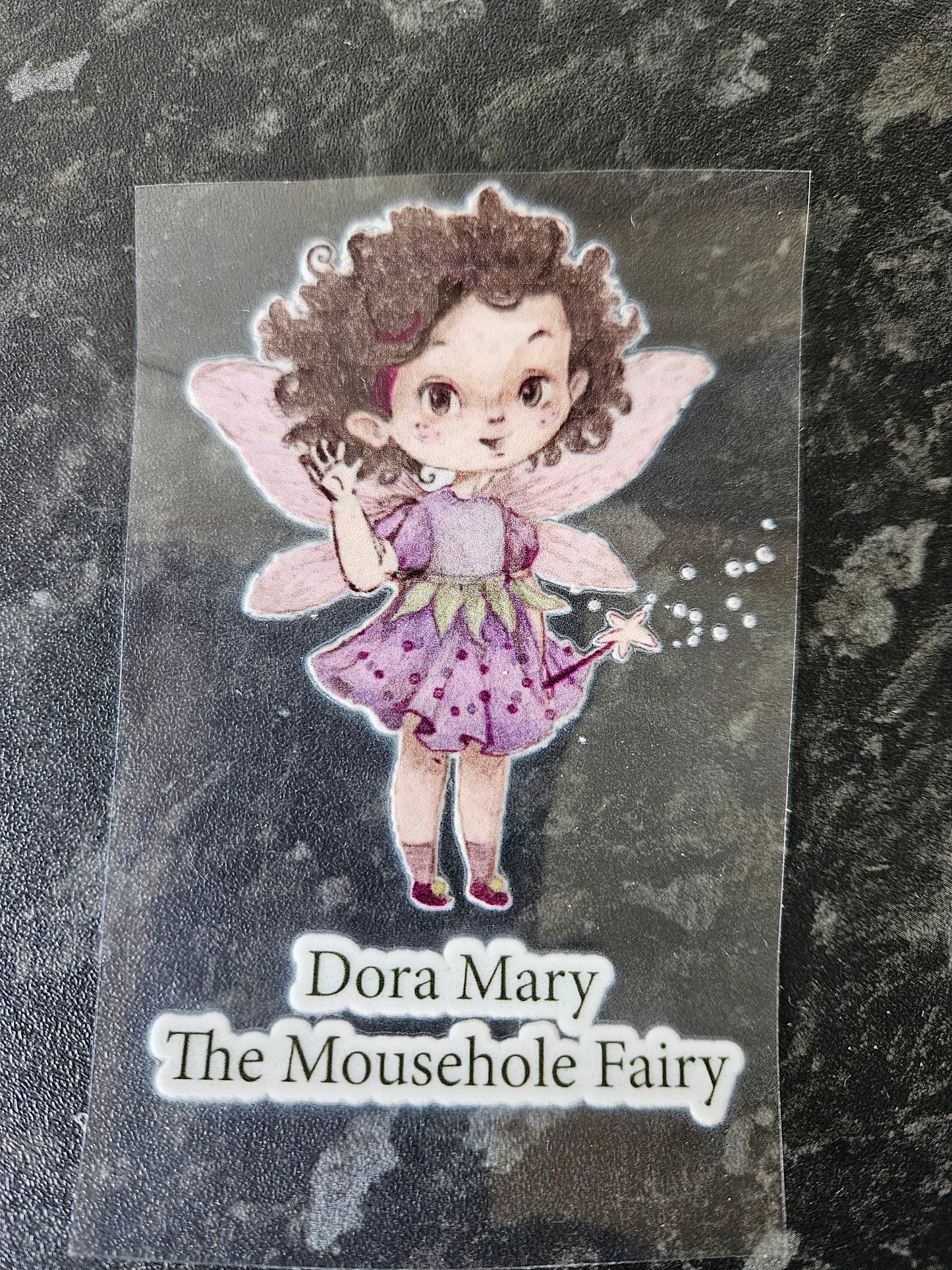 Dora Mary the Mousehole Fairy Water bottle sticker on clear backing, before it has ben put on a water bottle. ie what you will receive.