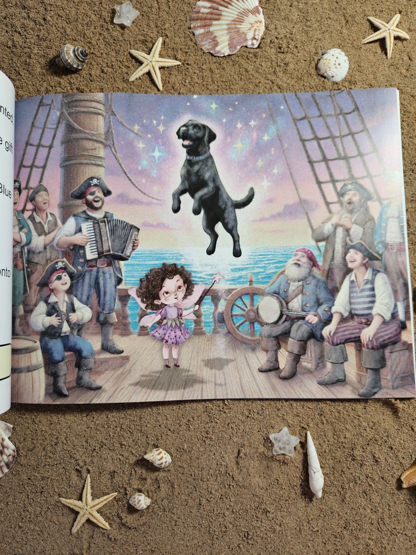 Picture of the pirates of penzance, sat around on deck, with Dora Mary waving her wand and saying a magic spell, and Dora Mary's dog Blue, flying on to deck.