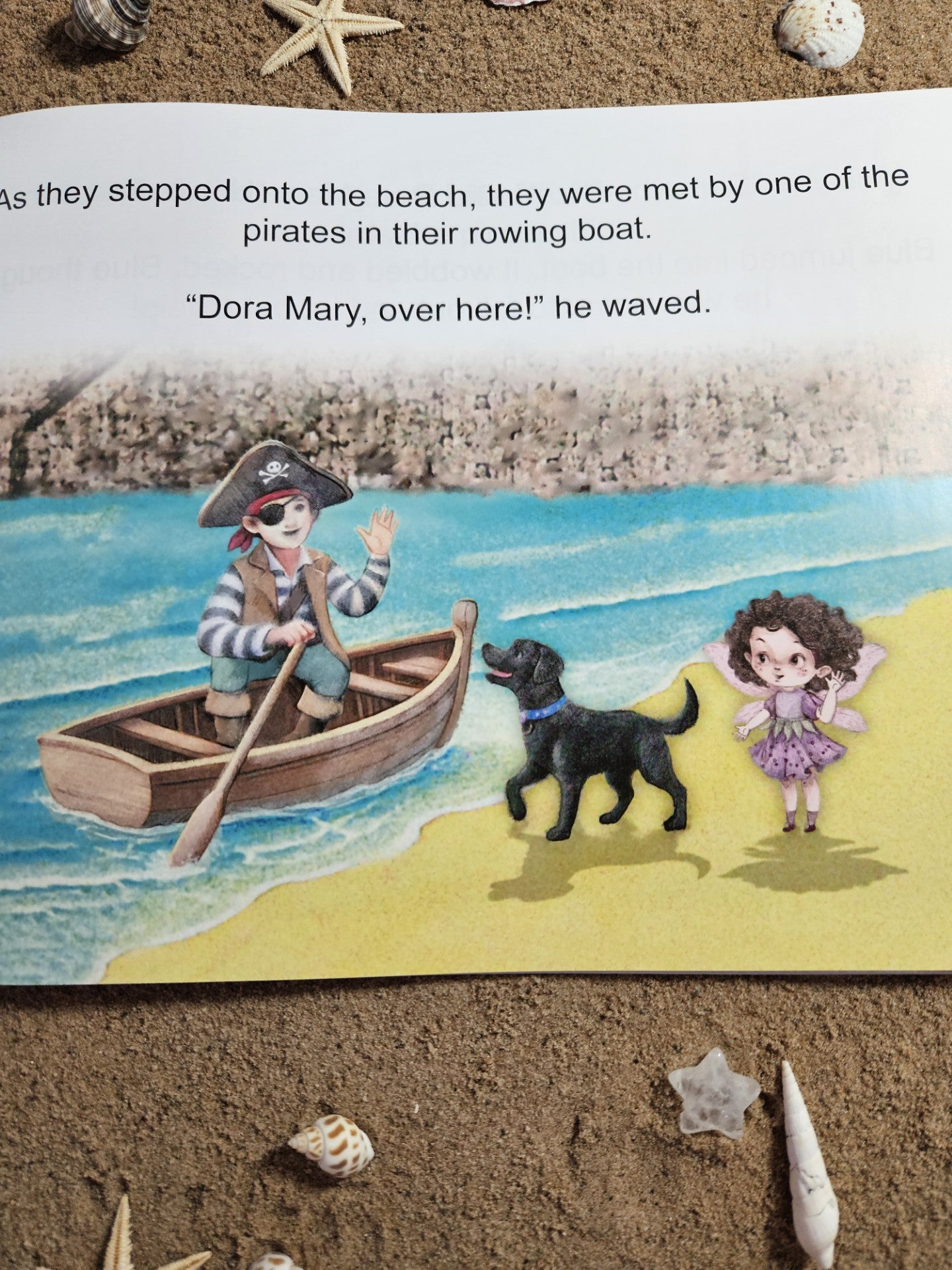 Picture of Dora Mary and Blue her faithful dog, on the beach in Mousehole harbour, being greeted by a pirate in a rowing boat.
